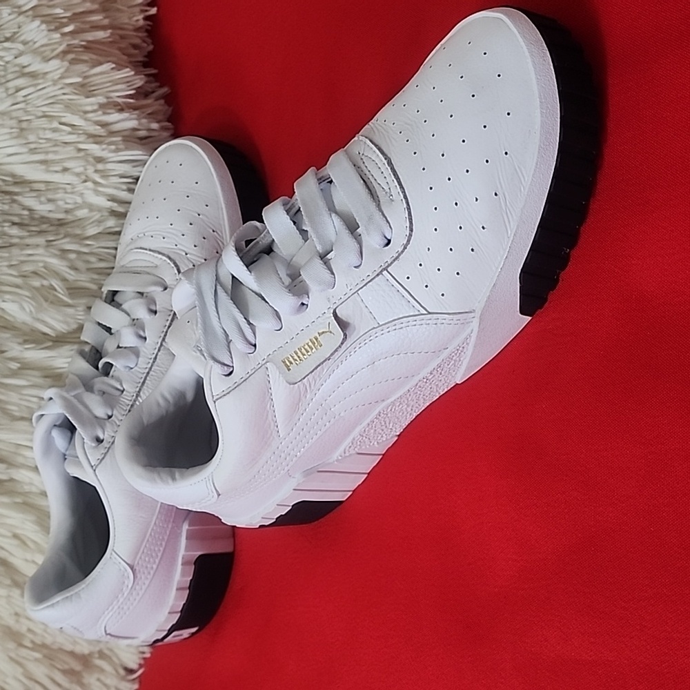 Puma White Sneakers with Black Sole Accents